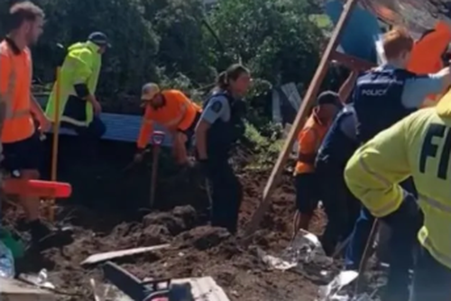 Emergency services work at slip at Mt Maunganui campground where several people are unaccounted for. Photo: Jess Pedersen