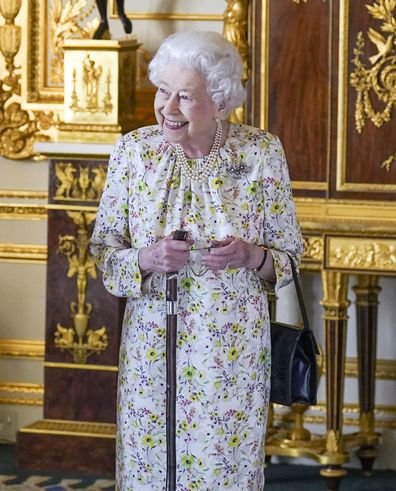 WINDSOR, ENGLAND - MARCH 23: Queen Elizabeth II arrives to view a display of artefacts from British craftwork company, Halcyon Days, to commemorate the company's 70th anniversary in the White Drawing Room at Windsor Castle, on March 23, 2022 in Windsor, England. The Queen viewed a selection of hand-decorated archive enamelware and fine bone china, including their earliest designs from the 1950s. (Photo Steve Parsons - WPA Pool/Getty Images)