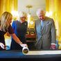 Charles and Camilla presented with Coronation Roll