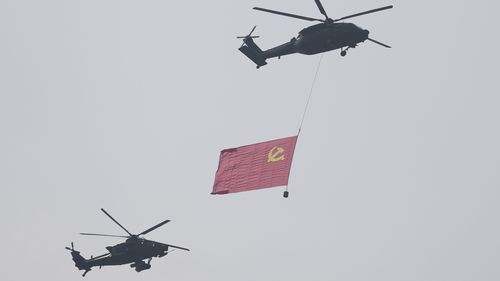 Helicopters take part in a military parade to commemorate the 80th anniversary of Japan's World War II surrender held in front of Tiananmen Gate in Beijing.