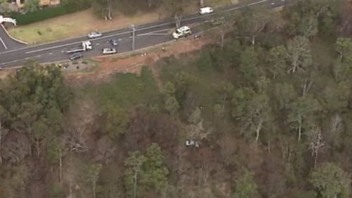 The car slid up to 80m down the hill on a lookout. (9NEWS)