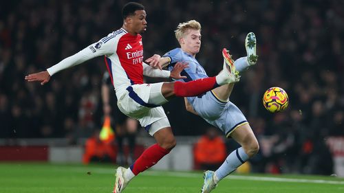 LONDON, ENGLAND - JANUARY 15: Gabriel of Arsenal and Lucas Bergvall of Tottenham Hotspur compete for the ball during the Premier League match between Arsenal FC and Tottenham Hotspur FC at Emirates Stadium on January 15, 2025 in London, England. (Photo by Alex Pantling/Getty Images)