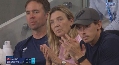 Alex de Minaur watches Katie Boulter play.