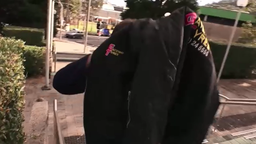 Jeffrey Smith arrived at Gosford Local Court with a jacket over his head. (9NEWS)