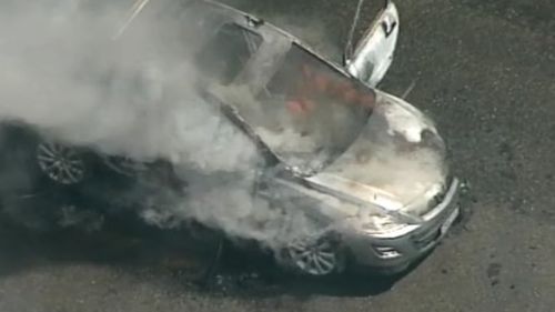 Two men have been taken to hospital with burns after a car fire in Yagoona. (9NEWS)