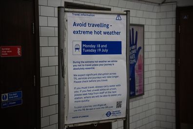 A notice in an underground train station warns people to avoid travelling where necessary because of the heat, on July 19, 2022 in London, England.  