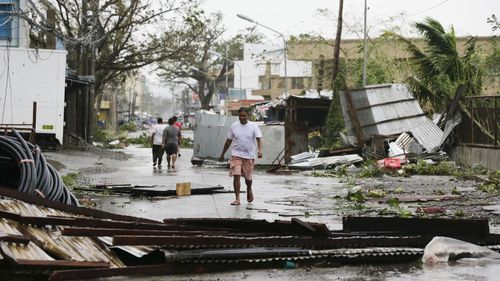 Witnesses say the storm's ferocious wind and blinding rain ripped off tin roof sheets and knocked out power at the start of the onslaught