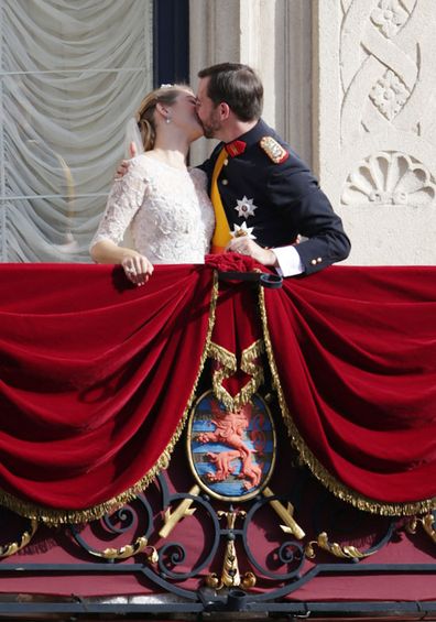 Princess Stephanie of Luxembourg and Prince Guillaume of Luxembourg kiss on the balcony of the Grand-Ducal Palace following the wedding ceremony of Prince Guillaume of Luxembourg and Stephanie de Lannoy at the Cathedral of our Lady of Luxembourg, in Luxembourg