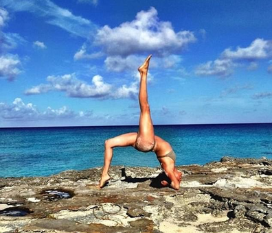 Meghan Markle Instagram post, doing a yoga pose at the beach