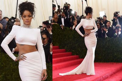 Rihanna shows off her toned midriff in a white two-piece gown.<br/><br/>(Images: Getty)
