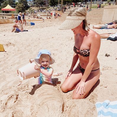 Kate Heussler at the beach with her toddler.