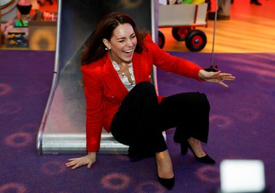 Kate Middleton, Duchess of Cambridge reacts as she slides down a slide during a visit at the LEGO Foundation PlayLab on February 22, 2022 in Copenhagen, Denmark.