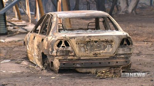 This torched car was parked beside a house that was also destroyed. Picture: 9NEWS