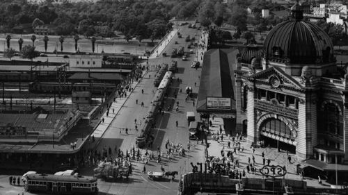 Flinders Street Station and Swanston Street in 1955. (Getty)