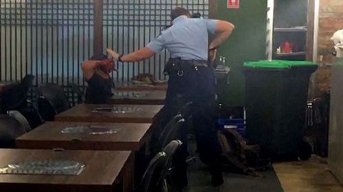 Alexander Villaluna being arrested in the Horsby restaurant in March last year.