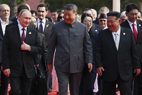 Front from left, Russian President Vladimir Putin, Chinese President Xi Jinping and North Korean leader Kim Jong Un arrive at a military parade.