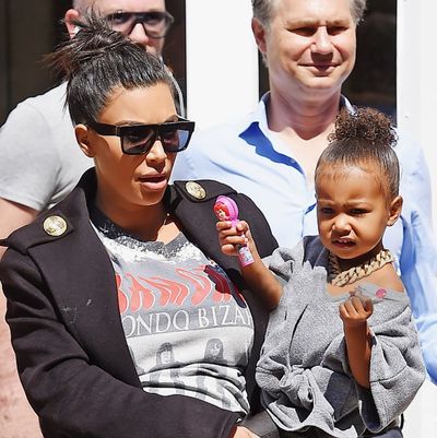 Kim Kardashian favours topknots for a casual outing with North.