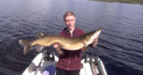 Swedish teen Jonathan Salomonsson with his big pike. (YouTube)