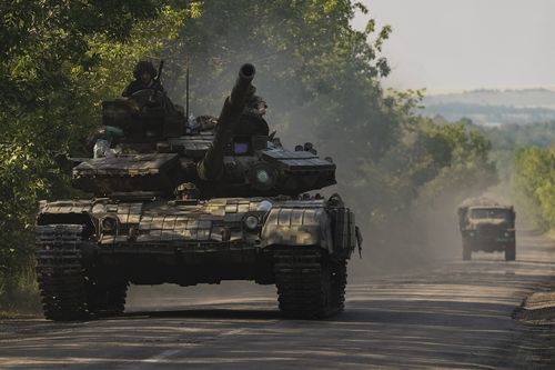 A Ukrainian tank drives in Donetsk region, eastern Ukraine, Thursday, June 9, 2022. 