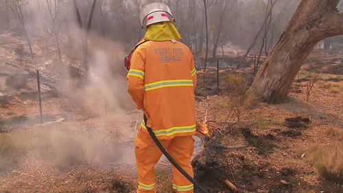 Authorities have warned rain will only provide temporary relief as more than 40 fires continue to burn across Queensland.