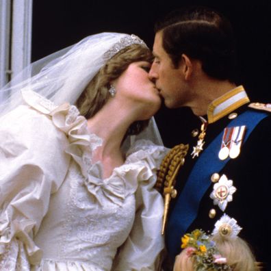 Diana Spencer and Prince Charles, Prince and Princess of Wales kiss on the balcony of Buckingham Palace after their wedding in July 1981