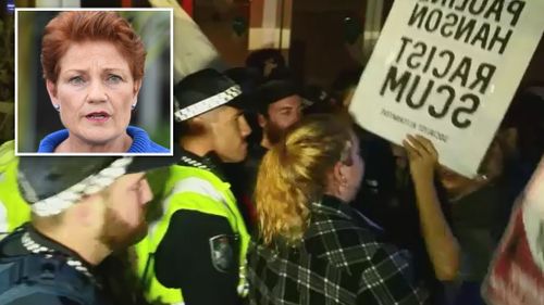 Protesters chanted anti-racism slogans outside Pauline Hanson's Senate launch. (9NEWS)