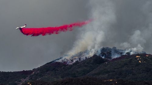 n total, 14,000 firefighters were battling blazes across California, which is seeing earlier, longer and more destructive wildfire seasons