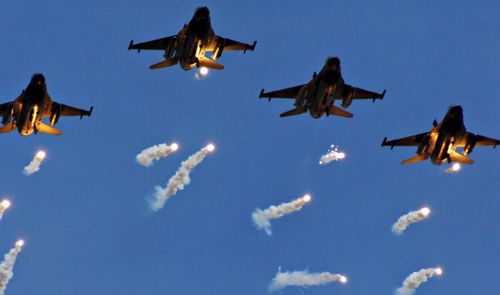 Taiwan Air Force F-16 fighters drop flares during a military exercise over the island. The US has approved a deal to sell parts of the American-built aircraft to Taiwan.