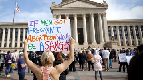 A person holds a sign during the Bans Off Oklahoma Rally on the steps on Oklahoma state Capitol to protest against the state's abortion bill.