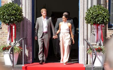 Prince Harry and Meghan, Duchess of Sussex, leave the town hall in Duesseldorf, Germany, Tuesday, September. 6, 2022. 