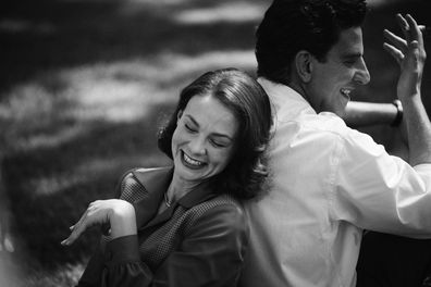 This image released by Netflix shows Carey Mulligan as Felicia Montealegre, left, and Bradley Cooper as Leonard Bernstein in a scene from "Maestro."