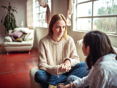 Mother and daughter at home having a  talk at home