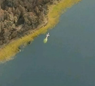 On the left you can see the wreckage of the helicopter. 
