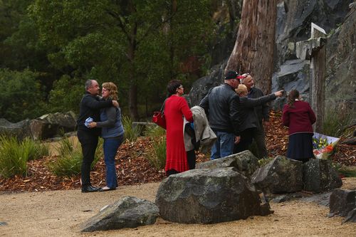 The historic town became infamous on April 28, 1996 when a gunman began shooting indiscriminately with a high-powered rifle on people visiting the site. Thirty-five people were killed and a further 23 were injured. In this photo, families of those killed gather at a memorial.