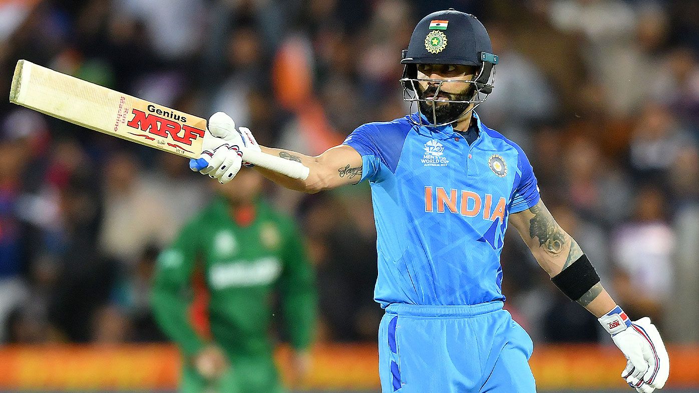 India&#x27;s Virat Kohli celebrates a half-century against Bangladesh