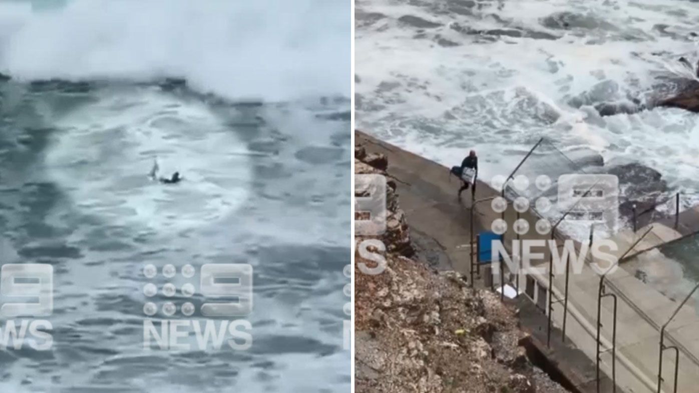 Kelly Slater snaps board in huge swell off Sydney&#x27;s Avalon Beach. (Nine)