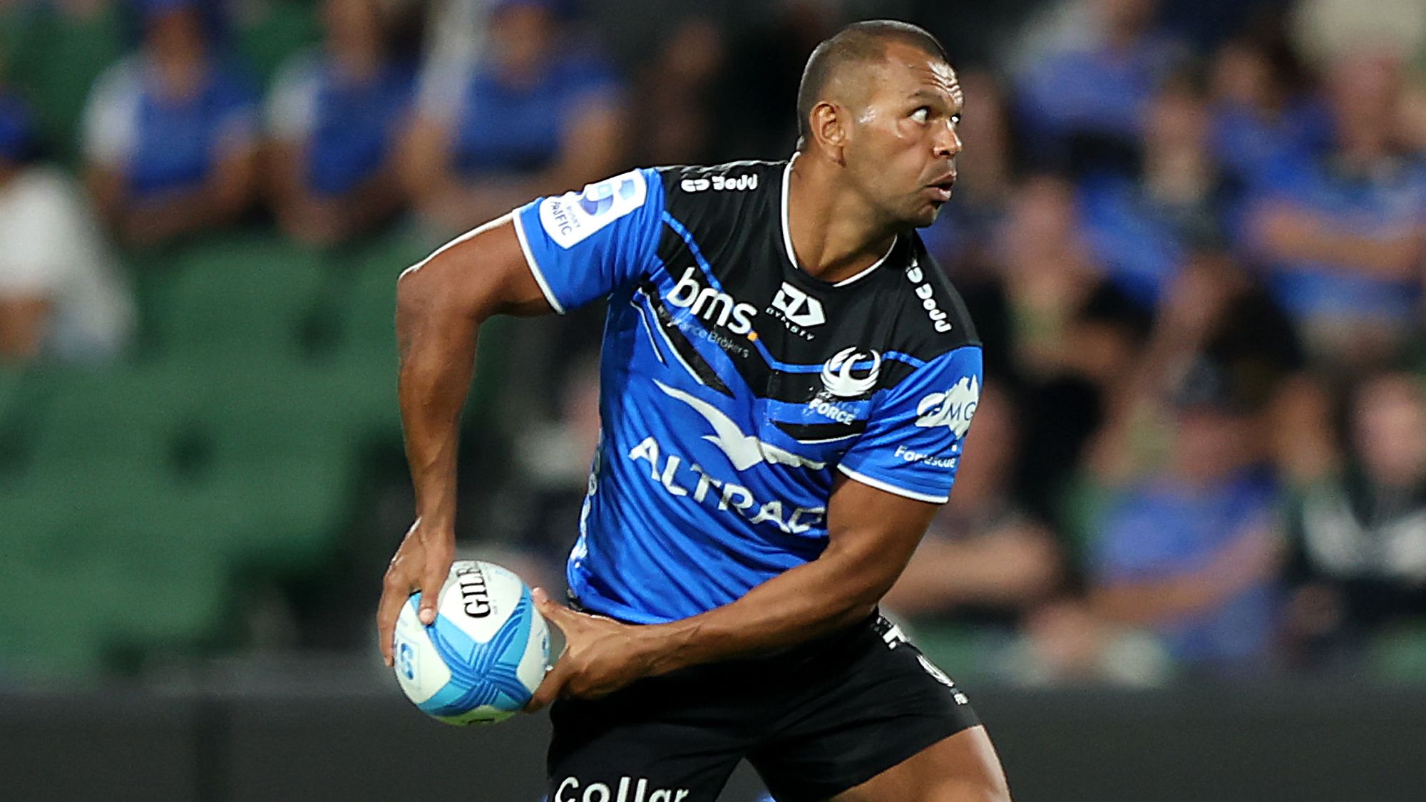 Kurtley Beale of the Force passes the ball.