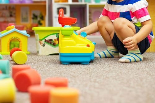 Child playing at a childcare centre stock image