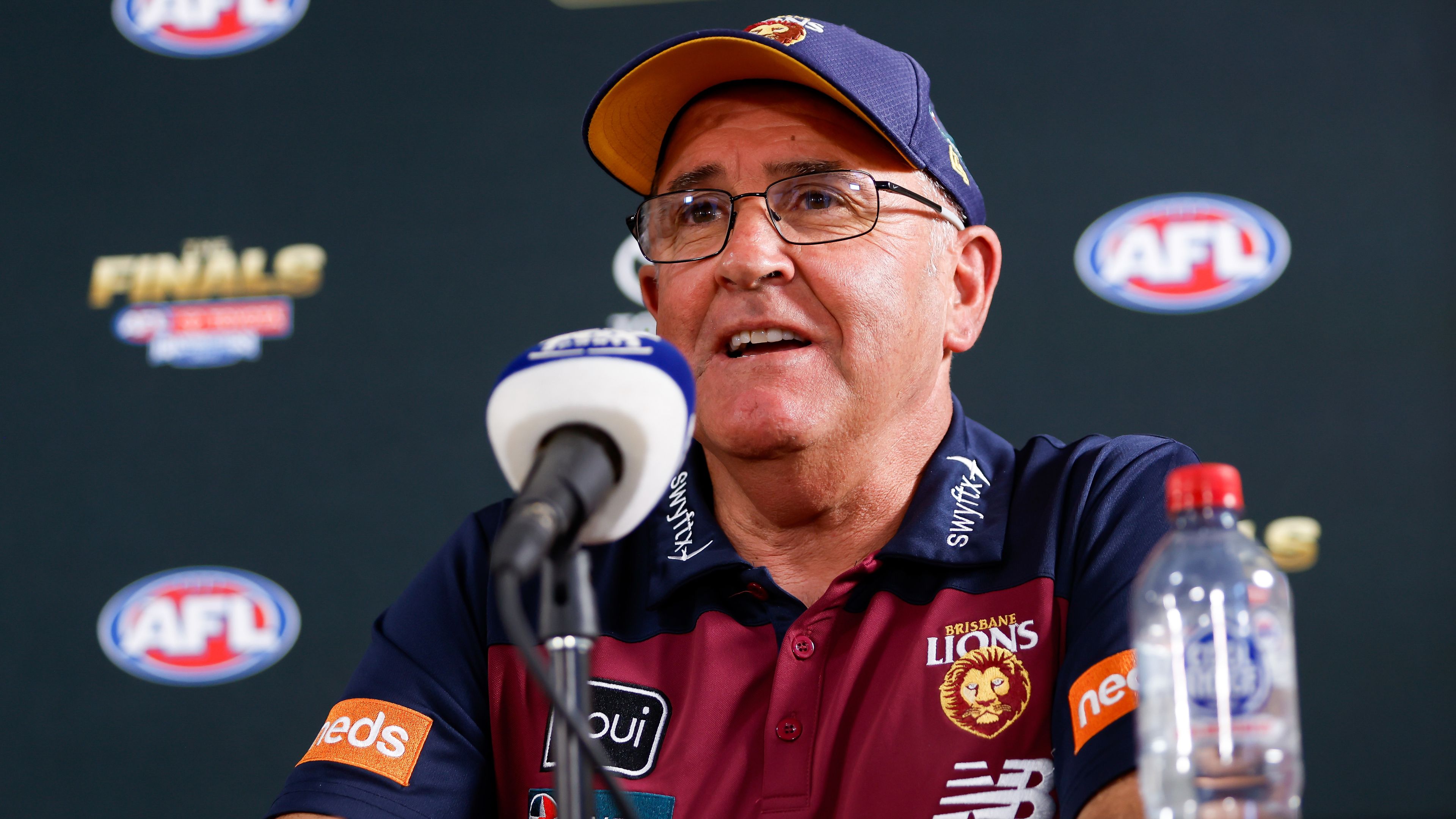 MELBOURNE, AUSTRALIA - SEPTEMBER 29: Chris Fagan, Senior Coach of the Lions speaks to the media during the 2023 AFL Grand Final Parade on September 29, 2023 in Melbourne, Australia. (Photo by Dylan Burns/AFL Photos via Getty Images)