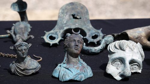 Some of the archeological finds are on display at the ancient port of Caesarea. (AAP)