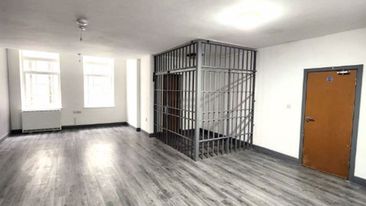 UK flat for rent with jail cell in living room domain 