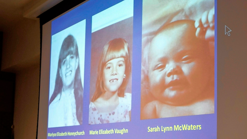 New Hampshire Senior Assistant Attorney General Jeffery Strelzin shows a slide of the three identified victims, Marlyse Honeychurch, left, and her daughters Marie Elizabeth Vaughn and Sarah Lynn McWaters