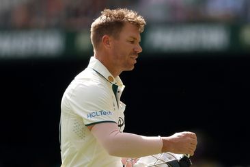 PERTH, AUSTRALIA - DECEMBER 16: David Warner of Australia looks dejected after being dismissed by Khurram Shahzad of Pakistan during day three of the Men&#x27;s First Test match between Australia and Pakistan at Optus Stadium on December 16, 2023 in Perth, Australia (Photo by Paul Kane/Getty Images)