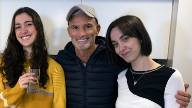 Former Socceroo's captain Craig Foster with his two daughters Jemma and Charli.
