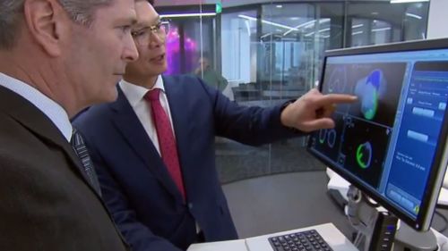 Stryker spokesman Rob Wood and Professor Peter Choong from St Vincent’s Hospital. (9NEWS)