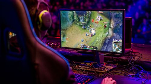 A professional gamer playing League of Legends computer game.