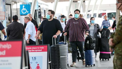 Buses taking people away for quarantine after they have arrived home from overseas.