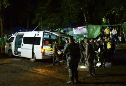 Rescue crews load one of the boys into the back of a van before he is taken to Chiang Rai Hospital. Picture: AAP