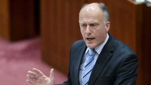 The leader of the government in the Senate Eric Abetz speaks during Senate question time at Parliament House. (AAP Image/Lukas Coch)