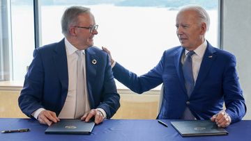 President Joe Biden, right, gestures to Australia&#x27;s Prime Minister Anthony Albanese following a document signing ceremony on the sidelines of the G7 Summit in Hiroshima, Japan, Saturday, May 20, 2023 